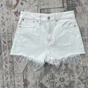 Madewell - high rise white denim shorts with frayed hem and button fly. #y2k